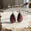 Joyería artesanal : aretes de rodonita rosa y negro y bisel de plata trenzada en forma de lágrima